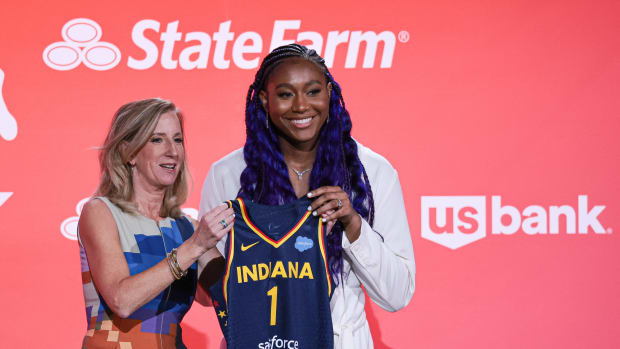 WNBA Commissioner Cathy Engelbert and Aliyah Boston pose for a photo.